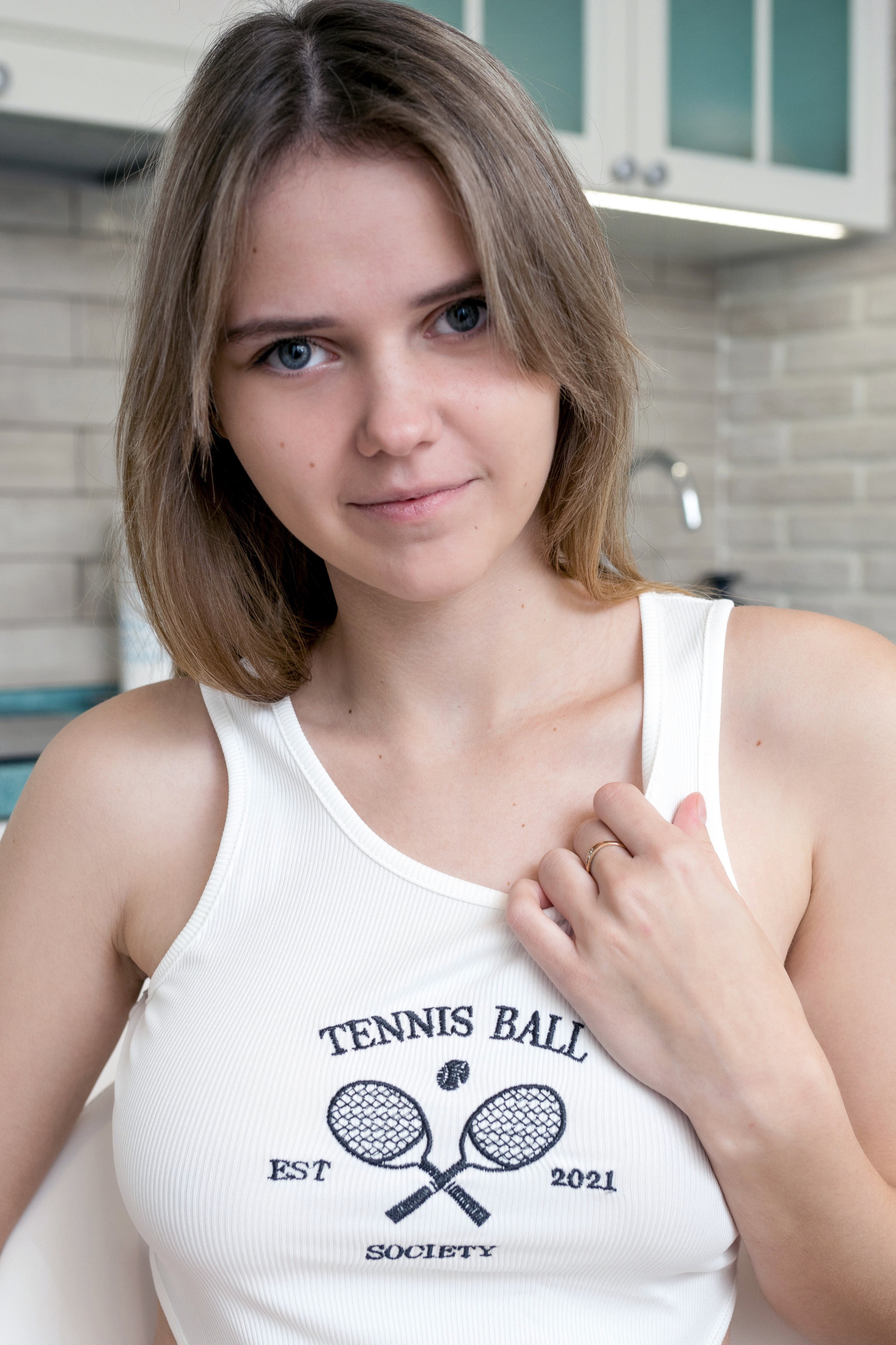 Indoor Shoot Of Sexy Brunette Girl With Sleeveless T-shirt And