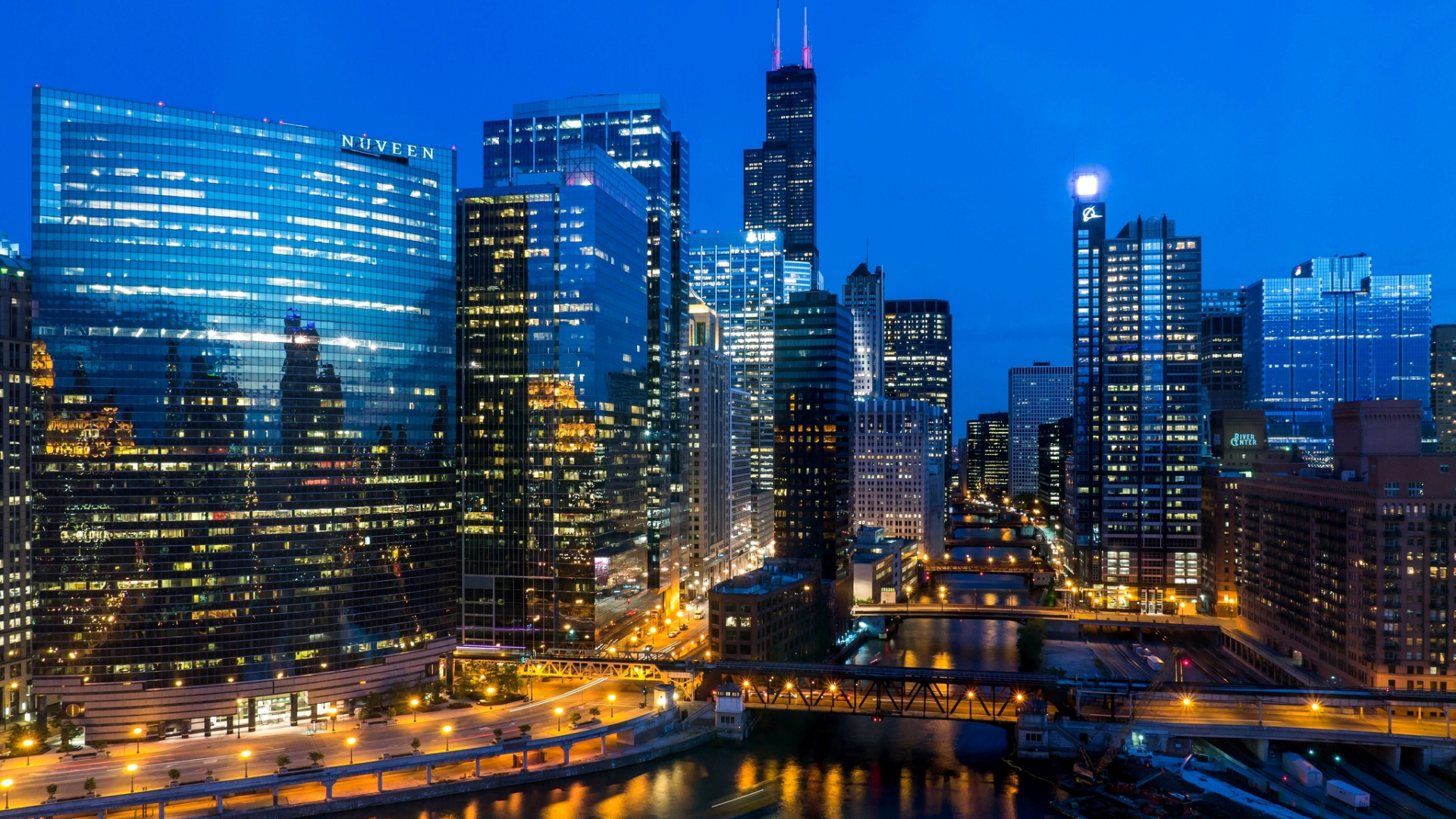 Download Chicago City Night Skyline With Blue Lights Wallpaper