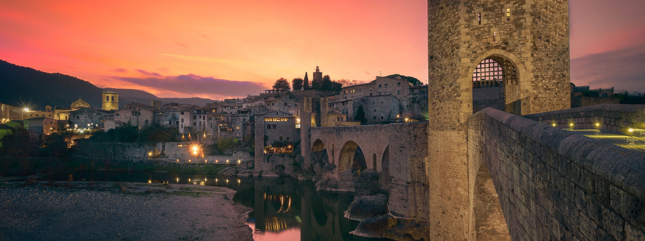 Download wallpaper sunset, lights, castle, wall, tower, the evening ...