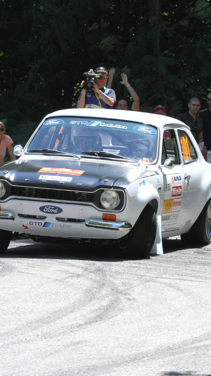 Download wallpaper Ford, turn, skid, Race, Escort, Ford Escort Mk1, Rallye  du Tessin, section ford in resolution 824x1464