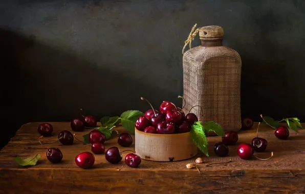 Leaves, light, cherry, berries, the dark background, table, bottle, wooden