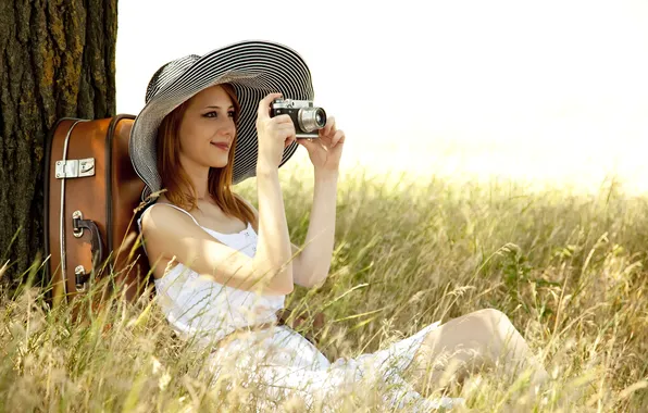 Grass, girl, face, smile, tree, hat, the camera, suitcase