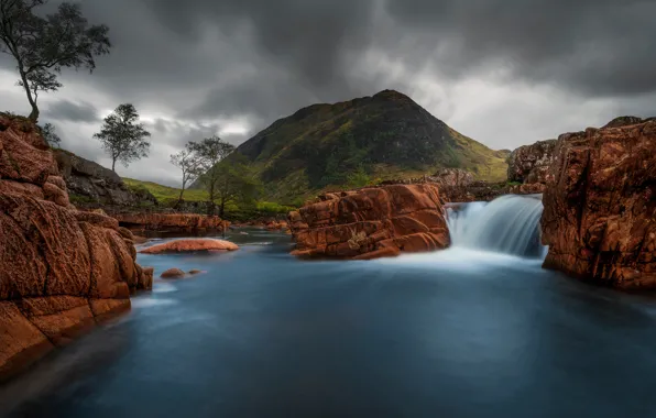 The sky, trees, mountains, clouds, stones, overcast, rocks, shore