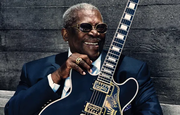 Picture singer, blues guitarist, .men's black suit jacket, celebrity m, bb king
