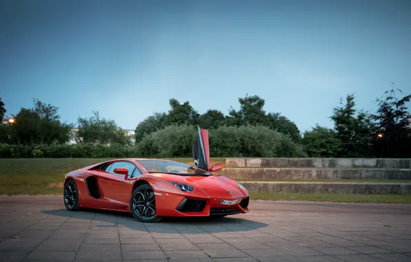 Picture the sky, clouds, trees, orange, shadow, lamborghini, orange, aventador