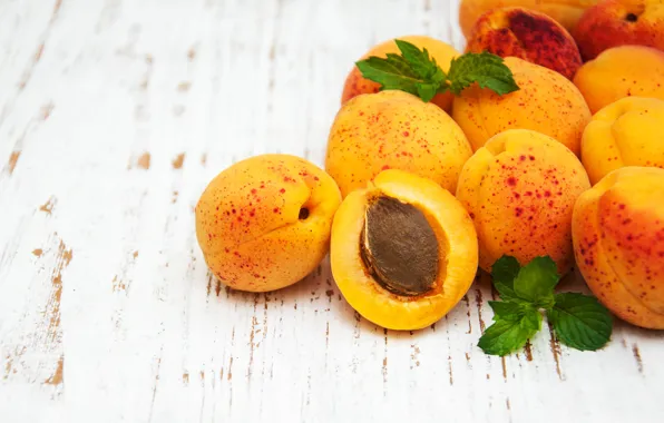 Wood, apricots, fruits on white background, Olena Rudo