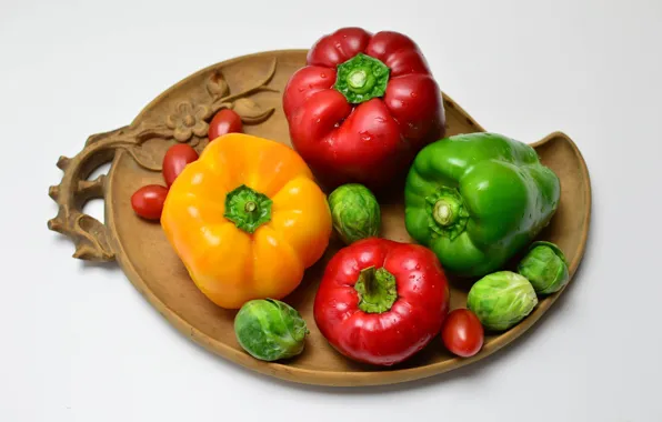 Pepper, vegetables, tomatoes, cabbage, pepper, carved plate