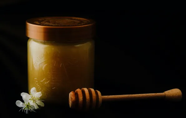 Picture light, honey, spoon, Bank, black background