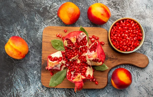 Peaches, grenades, cutting Board, pomegranate grains