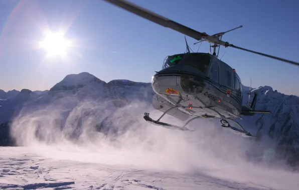 Picture the sun, mountains, Bell Helicopter Textron, UH-1 Iroquois (Huey), snow dust