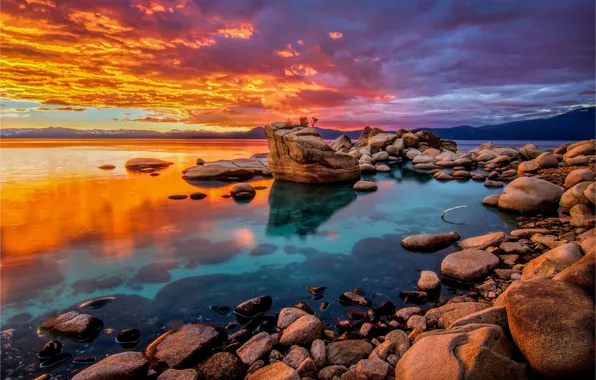 The sky, clouds, sunset, mountains, lake, stones, rocks, shore