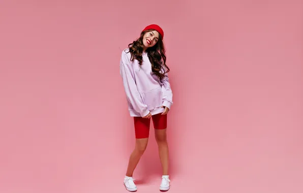 Picture girl, young, pretty, smiles, hoodie, oversized, cycling shorts, sincerely