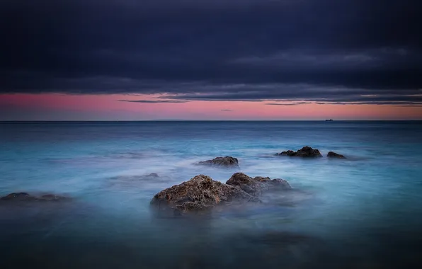 Picture sea, clouds, sunset, stones, storm, horizon