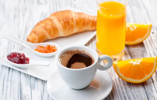 Coffee, oranges, juice, jam, croissants