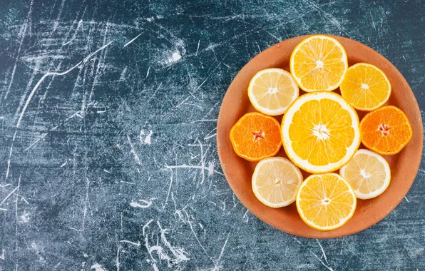 Oranges, bowl, citrus, halves, blue background, lemons, tangerines, cuts