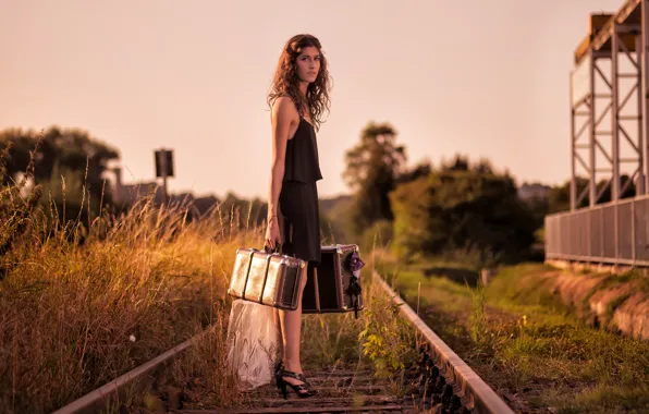 Picture girl, railroad, suitcases