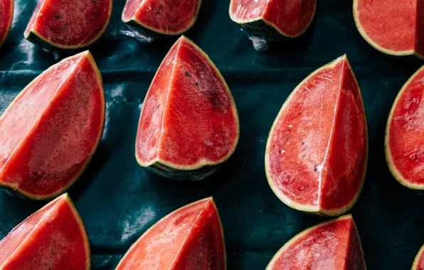 The dark background, watermelon, a lot, slices, cutting