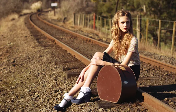 Girl, railroad, suitcase