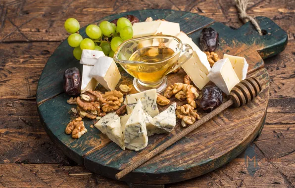 Cheese, honey, grapes, nuts, cuts, dates