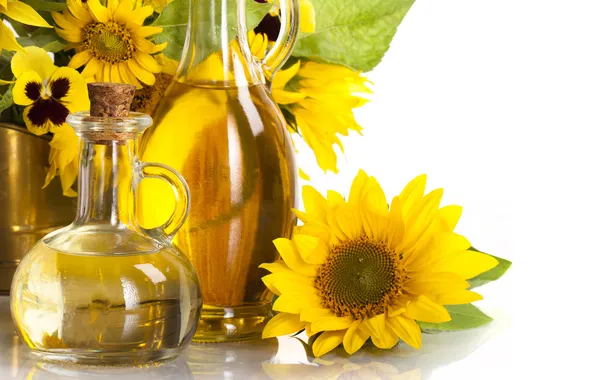 Picture leaves, sunflowers, oil, white background, bottles