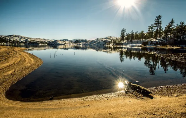 The sky, the sun, trees, mountains, lake