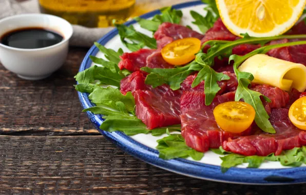 Picture lemon, meat, sauce, arugula, carpaccio