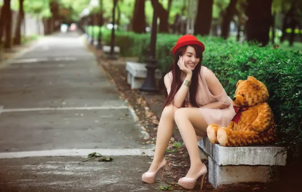 Girl, bear, bench