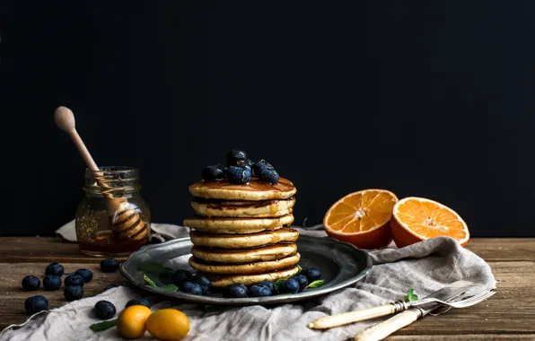 Oranges, blueberries, honey, plate, pancakes, jar