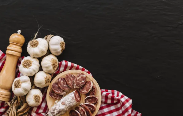 Fabric, black background, sausage, garlic
