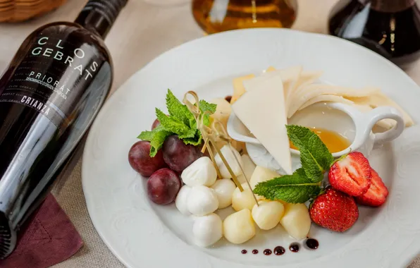 Wine, cheese, strawberry, grapes, cuts