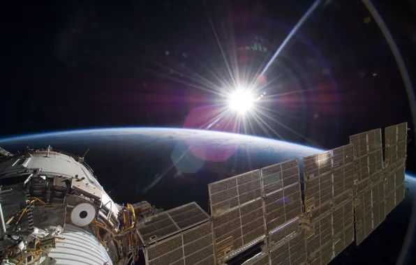 Picture the sun, light, earth, The international space station