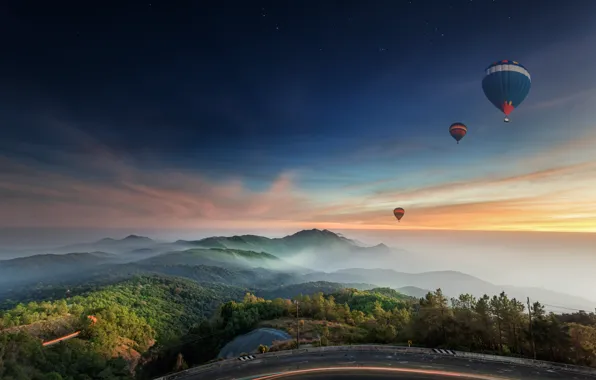 Road, balloons, hills, the evening
