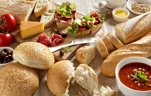 Cheese, bread, sausage, cakes, olives, sandwiches