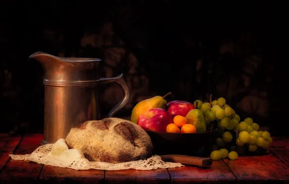 The dark background, table, apples, bread, grapes, knife, pitcher, fruit