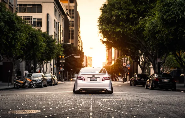 Picture the city, street, white, white, toyota, Toyota, camry, Camry