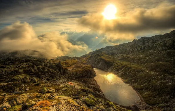 Picture the sun, clouds, mountains, lake, stones, rocks, height, Switzerland