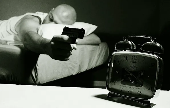 Gun, alarm clock, sleeping