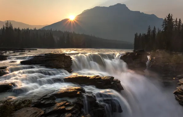 The sun, mountains, waterfall