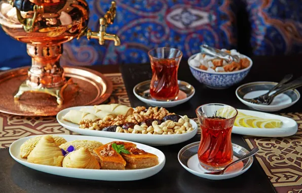 Lemon, tea, sweets, nuts, samovar, baklava
