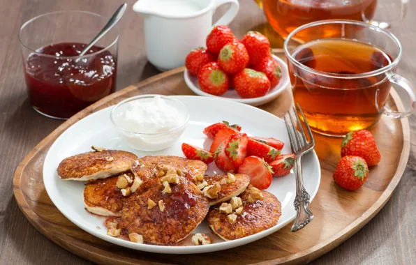 Picture tea, strawberry, jam, sour cream, pancakes