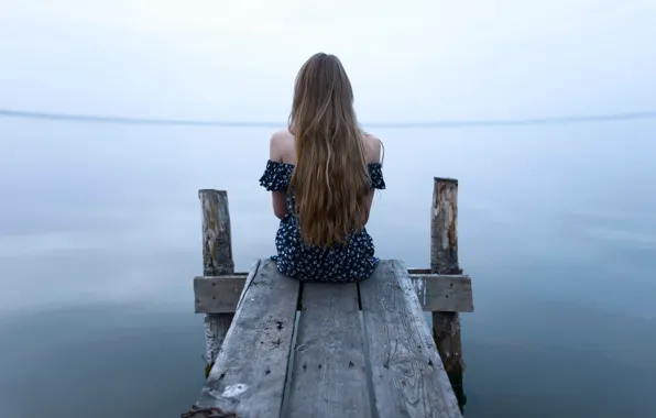 Picture loneliness, the water, long-haired girl