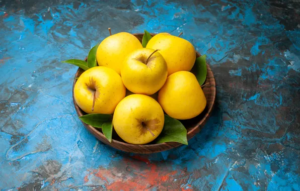 Apples, yellow, blue background