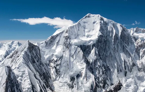 The sky, clouds, snowy mountains