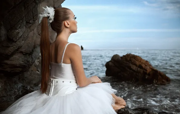 Ballerina, in a white dress, coast