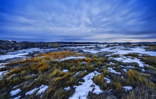 The sky, grass, water, clouds, snow, mountains, the evening