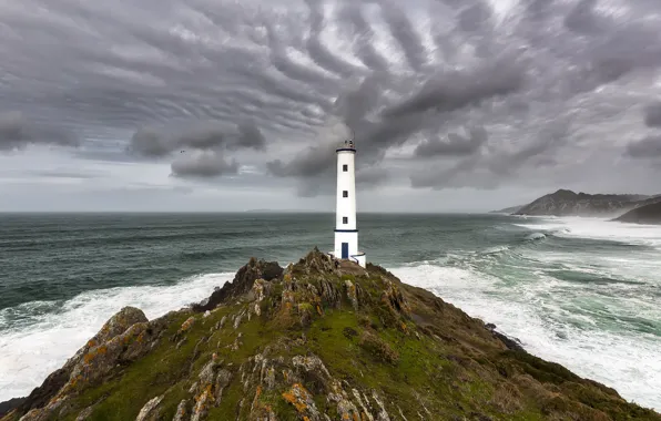 Sea, the sky, clouds, rocks, shore, lighthouse, gloomy sky