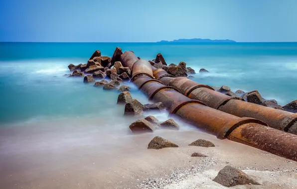 Sea, the sky, stones, pipe