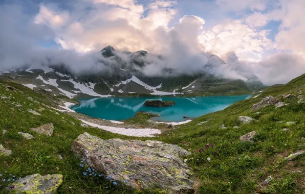 The sky, clouds, flowers, mountains, lake, stones
