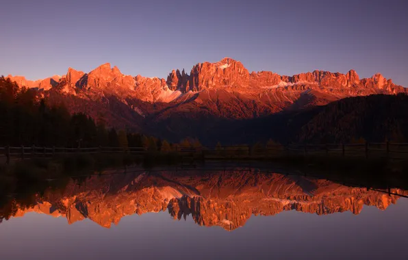 Light, sunset, mountains, lake, reflection, rocks, shore, tops