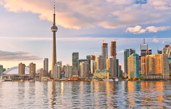 The sky, clouds, lake, coast, building, tower, home, skyscrapers